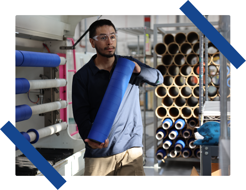 man holding rolls of tape